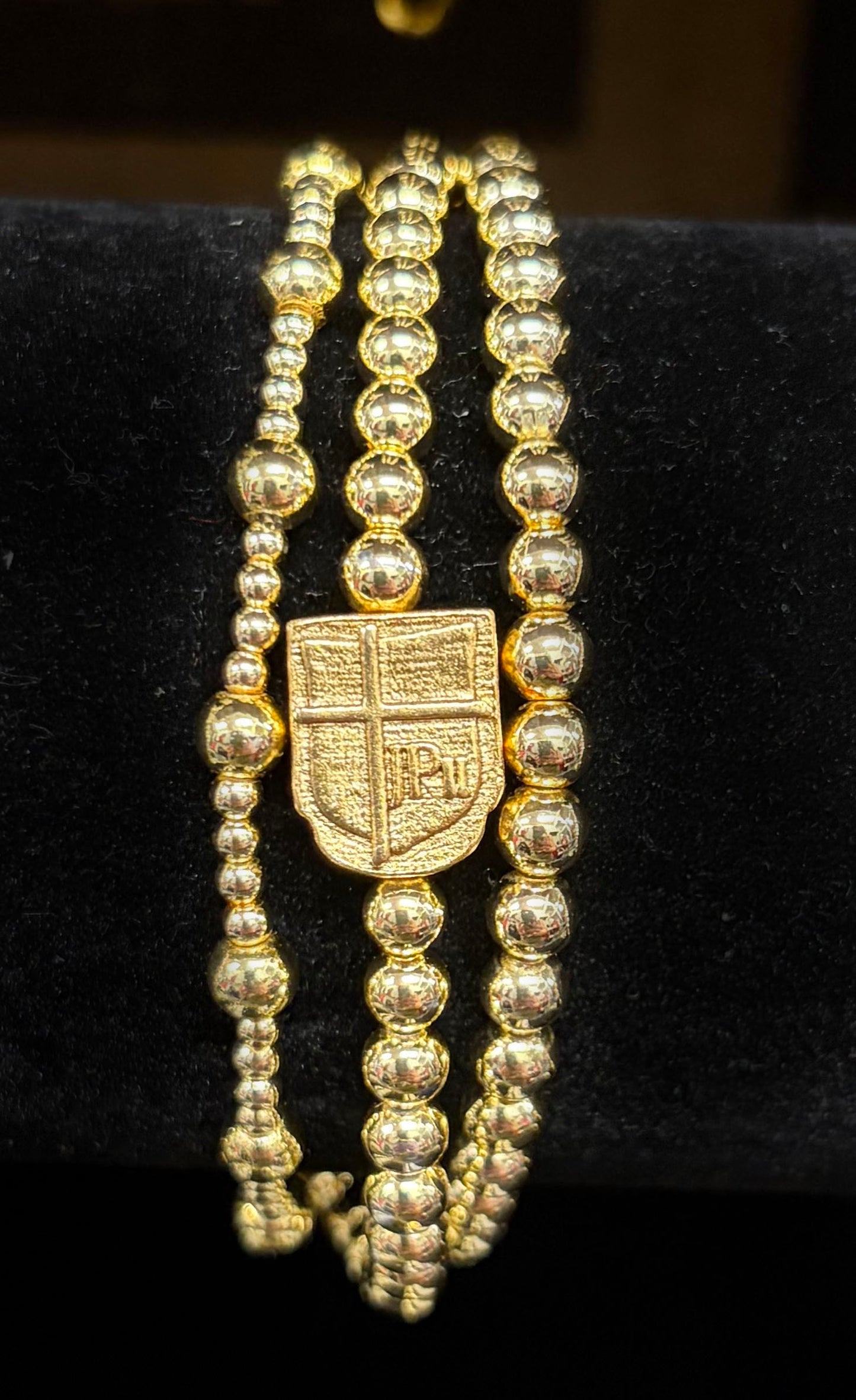 3 Gold Bracelets with JPII Shield